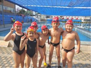 張心慈 - 帶少泳隊的選手參加比賽