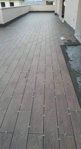 安氏國際。 磁磚。油漆。 家庭裝修 - 頂樓木紋磚施工-國外施工