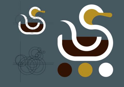 賴光奕 - 當歸鴨LOGO，以極簡的色塊和三種色系搭配，鴨身採用當歸色填充白邊象徵湯碗，鴨翅則是象徵湯匙。寓意當歸藥材完美融入鴨子本身使其鴨肉內蘊涵著整晚當歸湯的營養。