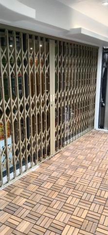 清文有限公司 - 烤漆香檳金伸縮門