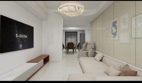 綠灣室內裝修設計有限公司 - 很多業主喜愛現代簡約風格的設計。這個設計採清爽的配色與精緻的佈置，整體氛圍溫馨又不失格調。

簡約設計尤其需要現代感家具做搭配

這個空間主要設計特色：

&bull; 主色調為白色、米色與淺木色，打造出明亮且柔和的空間感。
&bull; 電視牆使用的是一種灰白色石材，看起來像是人造大理石或花崗岩，具有柔和自然的紋理與霧面質感。

&bull;棕色與暖灰色的抱枕和沙發增添了自然溫度，讓視覺更具層次